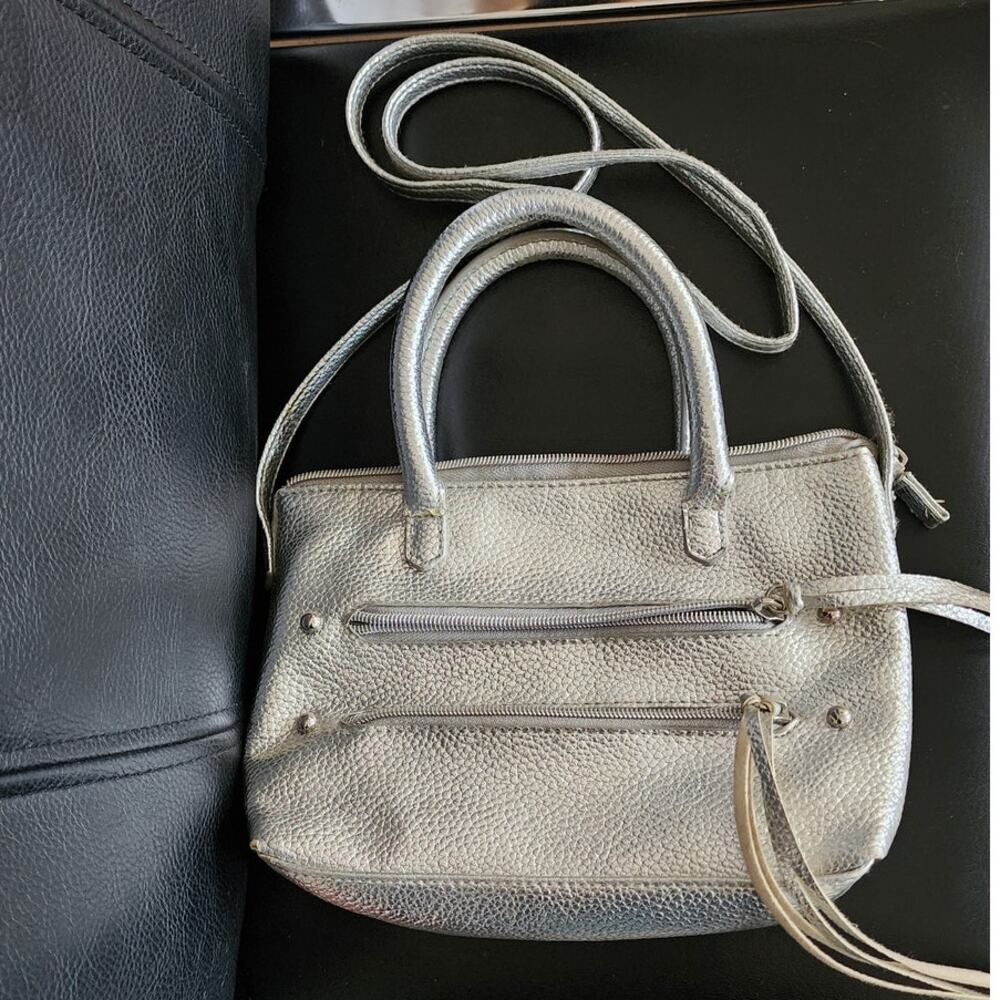 Justice Silver Cross body Bag with tassles measures 9 x 6 x 2